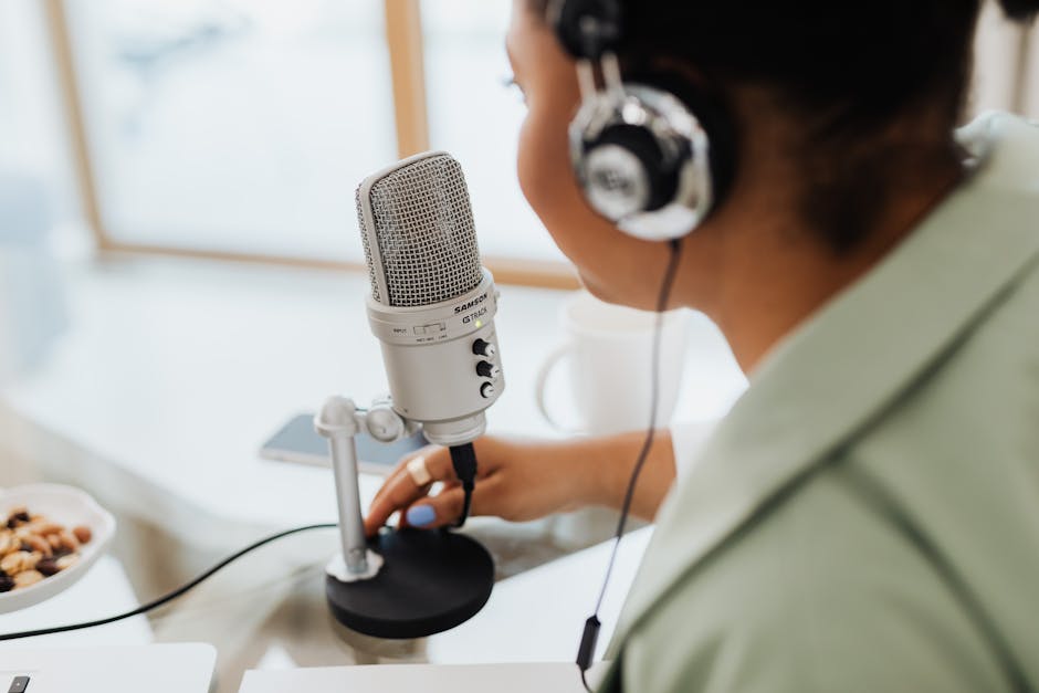 Professional podcast interview setup with microphones and headphones